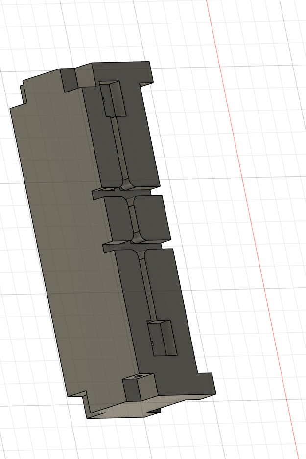 Underside of a component showing cable-routing channels cut into the printer-bed-facing side